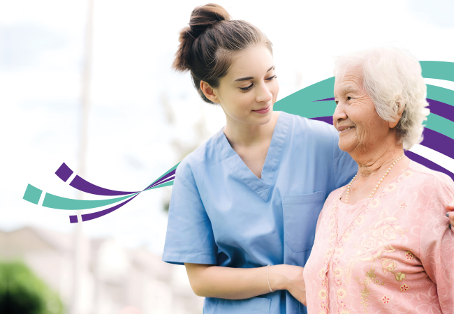 Care workers assisting an elderly woman with personal hygiene