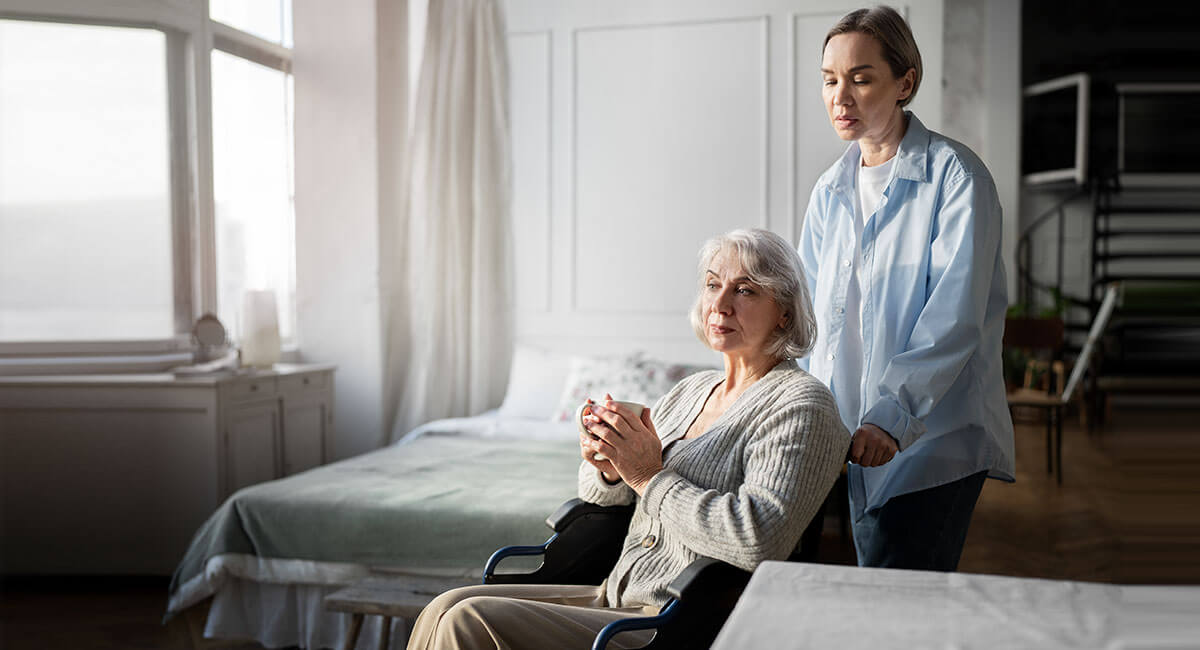 A carer delivering in-home care for an elderly Alzheimer's patient.