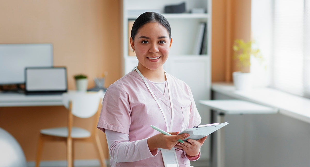 A specialised care worker with a patient document in hand.