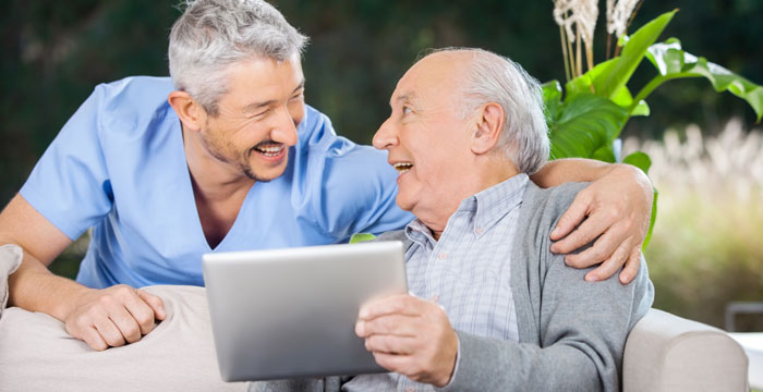 Carer providing companionship to an adult in the comfort of their own home