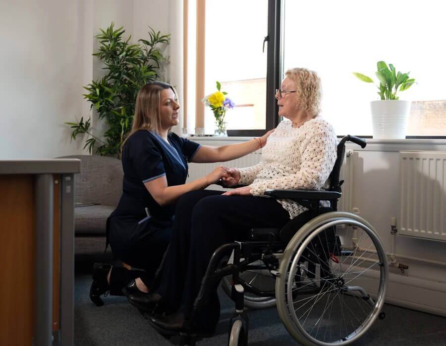 A carer providing respite care to a senior with a physical disability